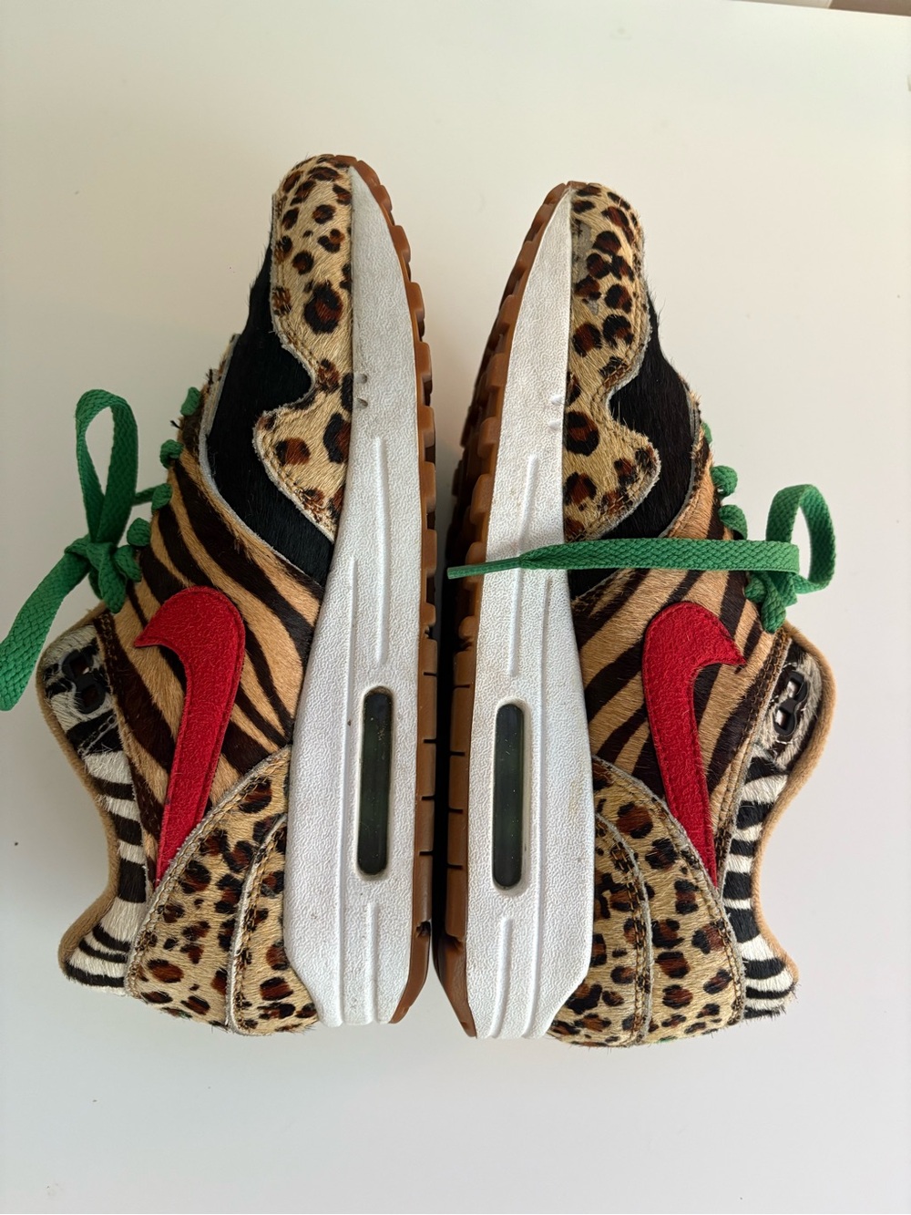 Nike Animal Print Sneakers with Red Swoosh and Green Laces